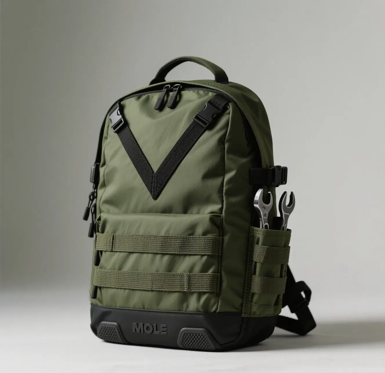Waterproof backpack floating half submerged in calm lake water with its rolled mouth above the surface