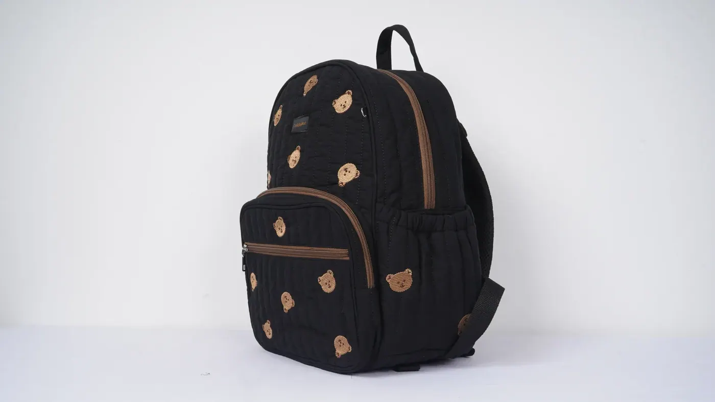 Waterproof commuter backpack with the laptop compartment open showing a suspended 15 inch sleeve and foam base clearance