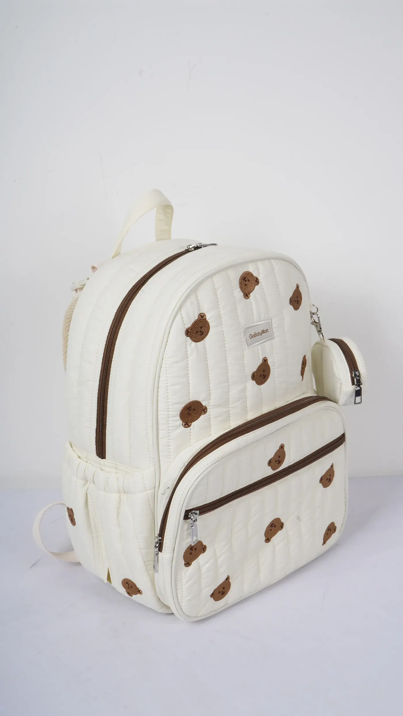Compact waterproof backpack packed for a wet day hike showing water bottles, shell jacket and packed lunch inside the main compartment