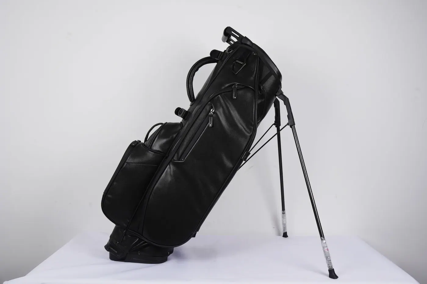 Range of compact waterproof backpacks in three torso sizes and four colours laid out for a programme approval meeting