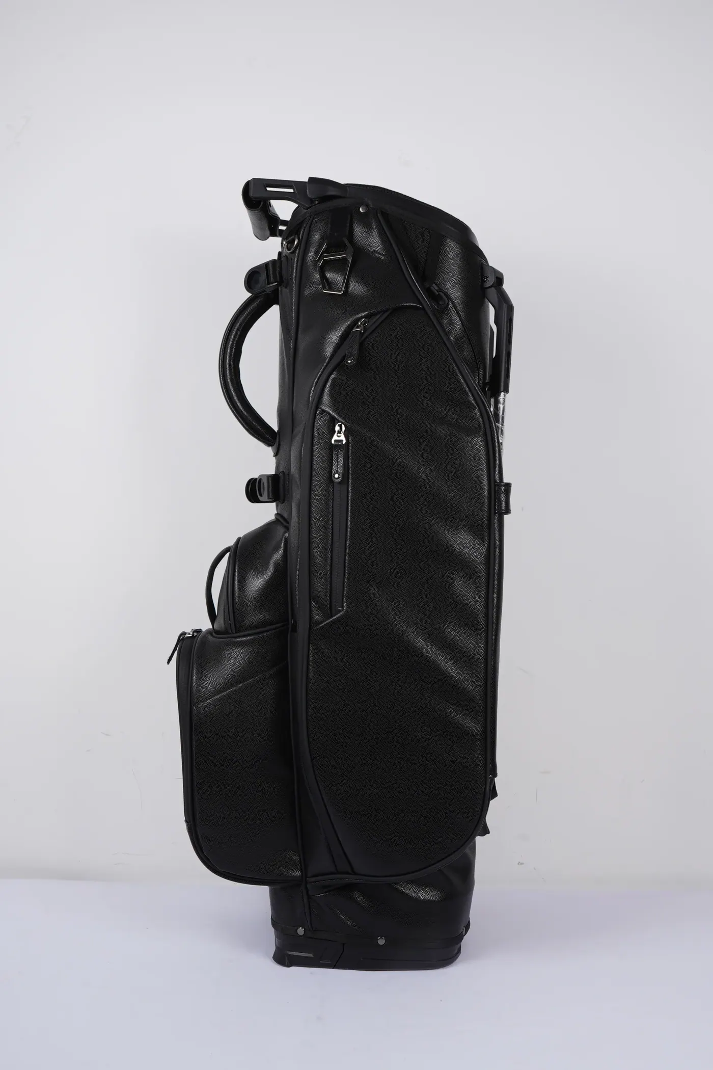 Waterproof backpack with a buckled storm flap over the main opening and a magnetic roll-over top shown open