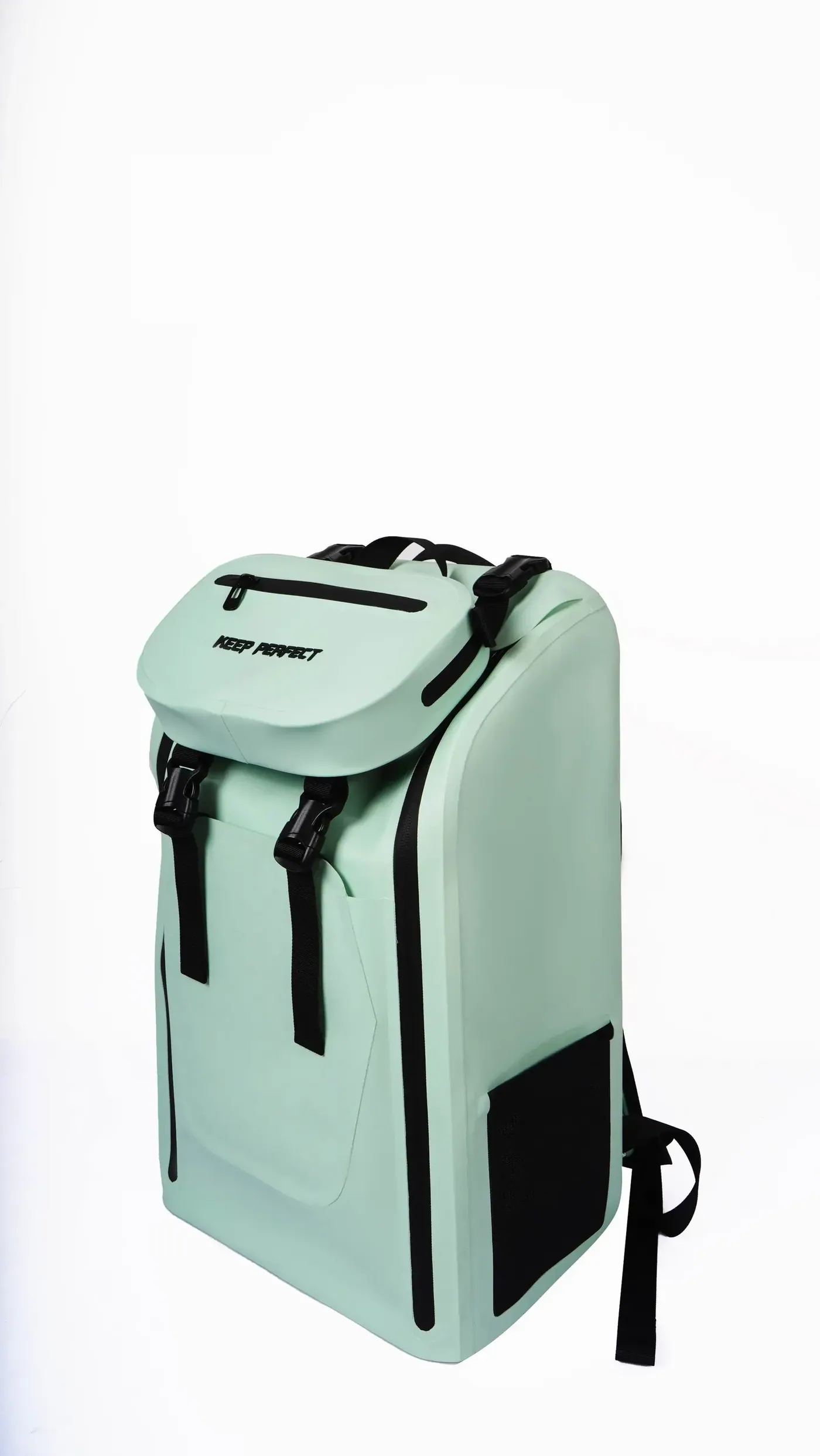 Cyclist wearing a waterproof backpack with a sternum strap and a retroreflective panel on a wet city street