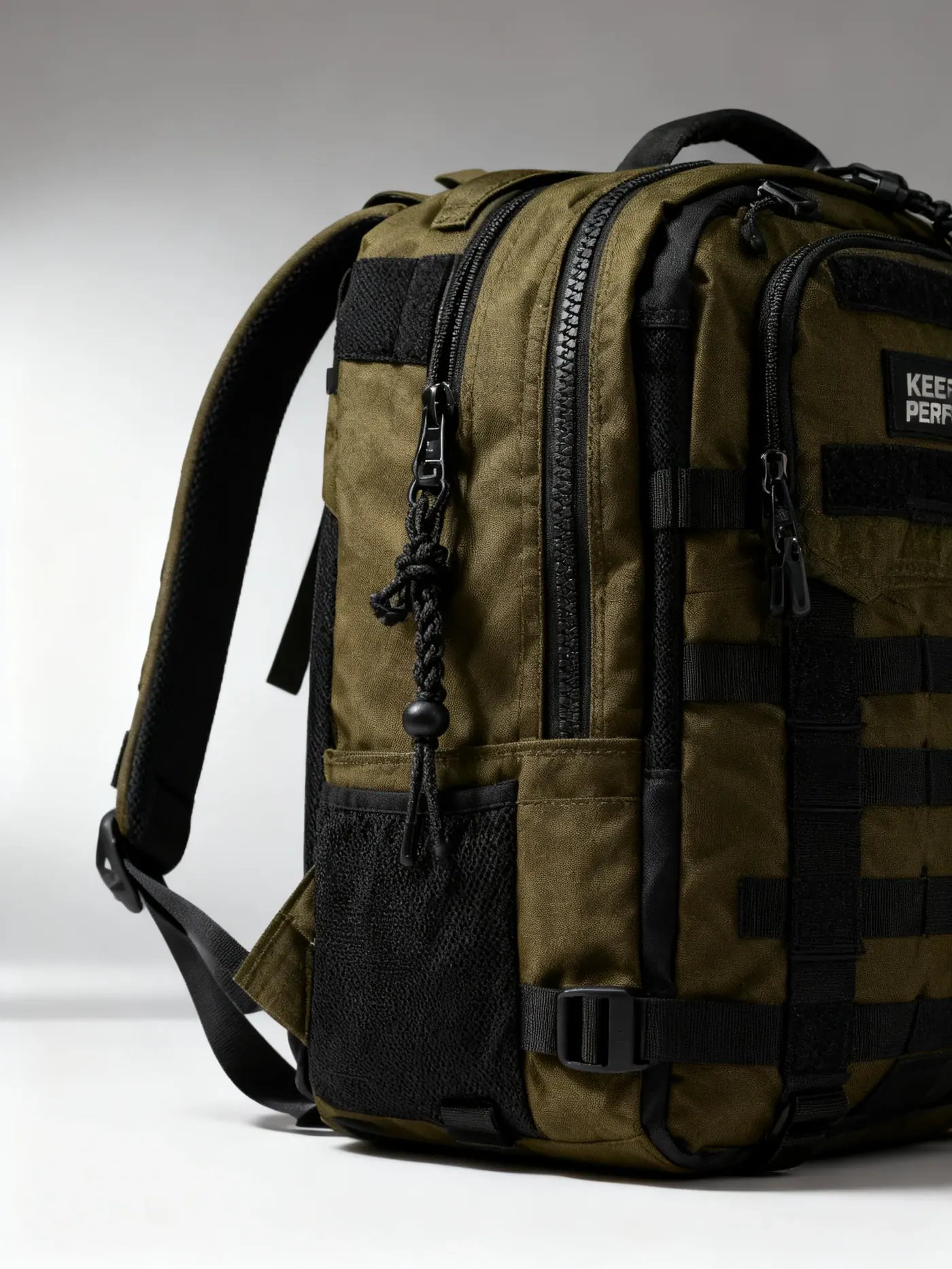 Outdoor backpack standing upright showing a wide flat side panel and gently radiused corners along the seam paths