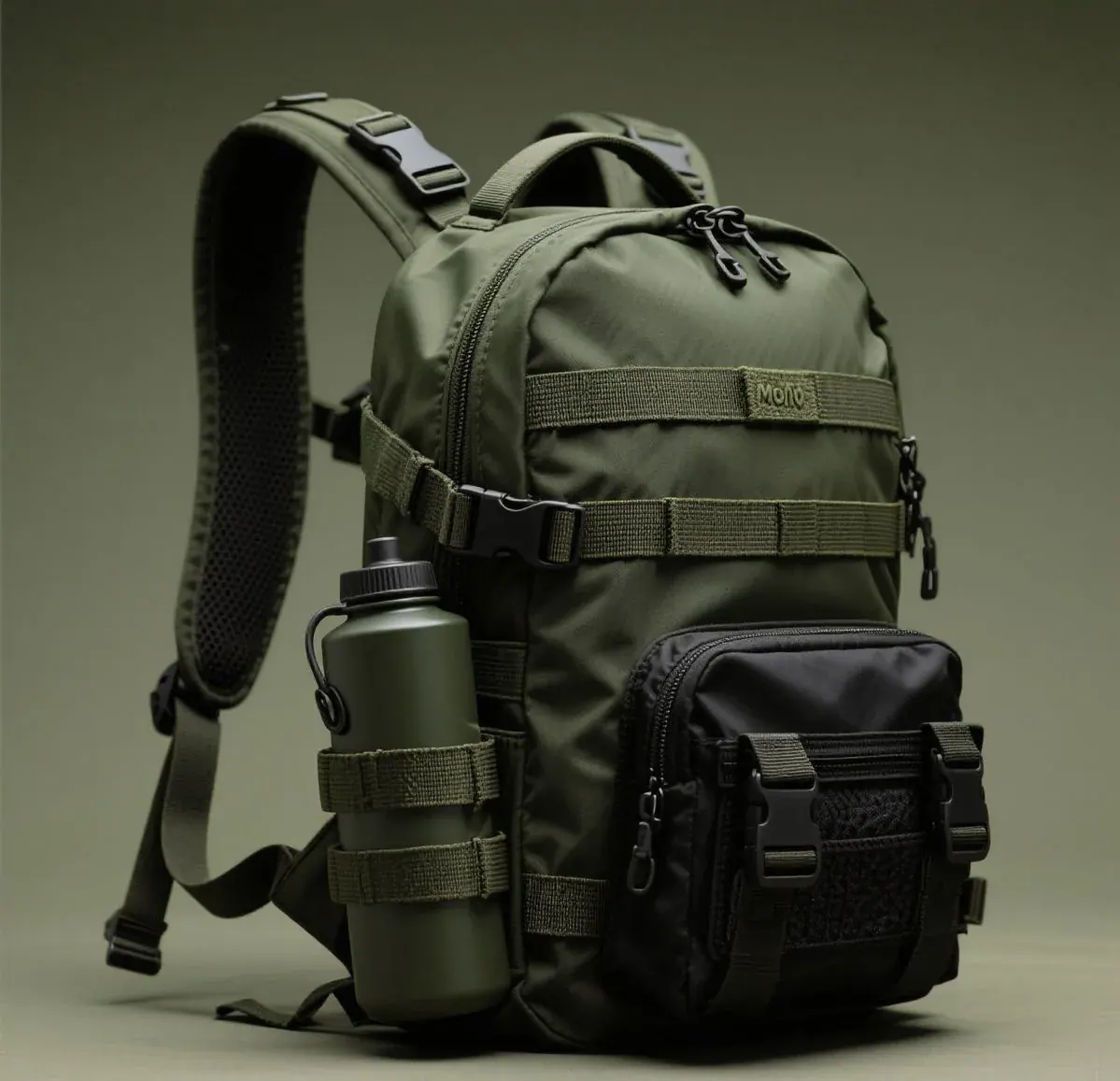 Drone field operator carrying a waterproof backpack on a wet hillside with a landing pad secured to the outer panel