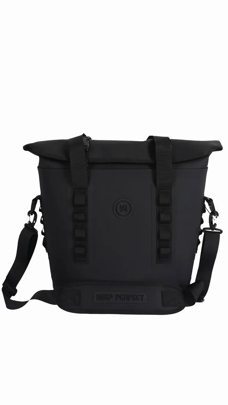 Sealed dry-bag style waterproof pack floating beside a swimmer in open water attached to a short tow leash