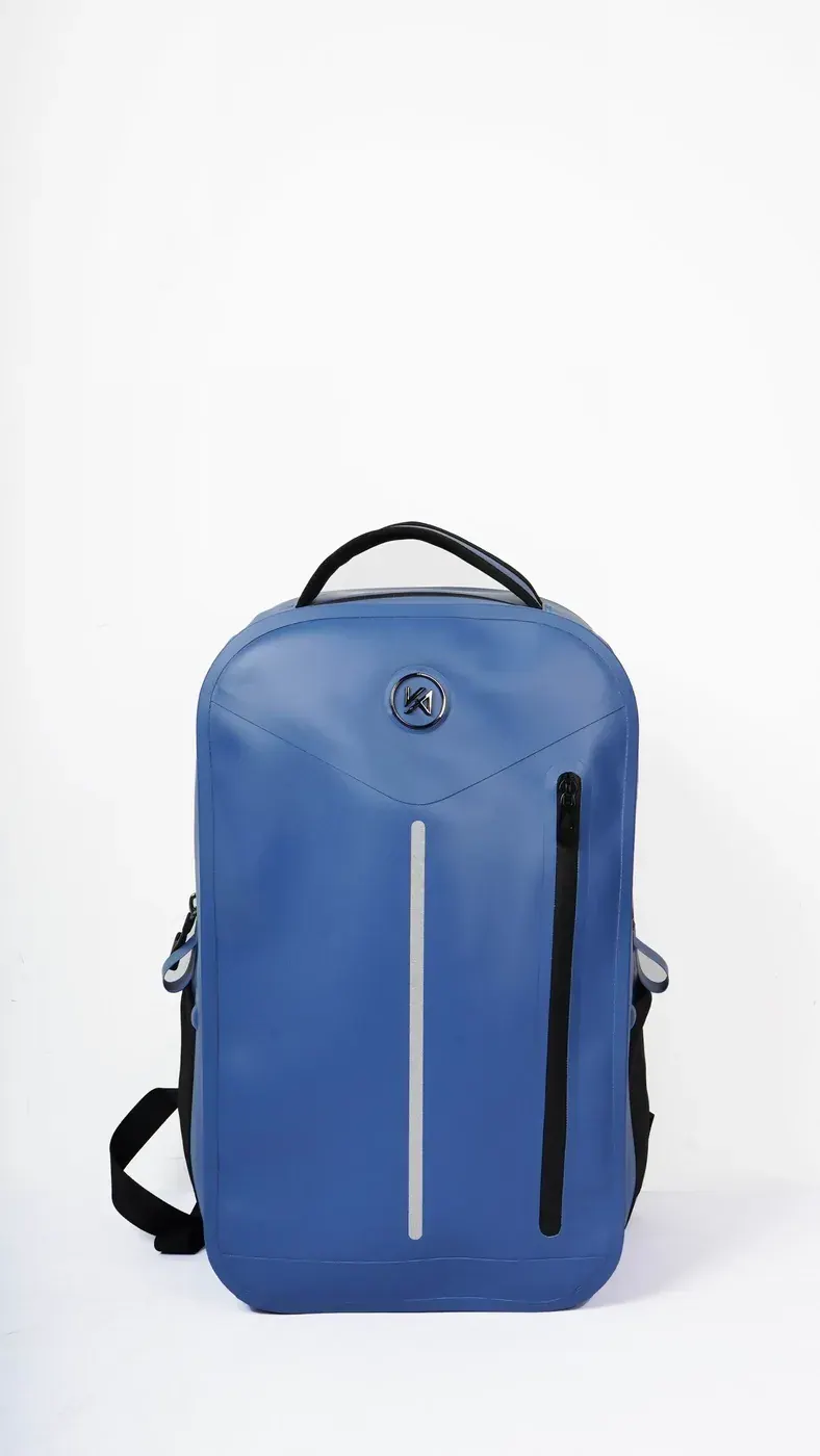 Waterproof dry liner being rolled shut inside a large expedition backpack to protect a sleeping bag from rain