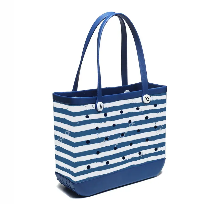 Large perforated EVA tote packed with upright bottles low and towels folded above showing load distribution